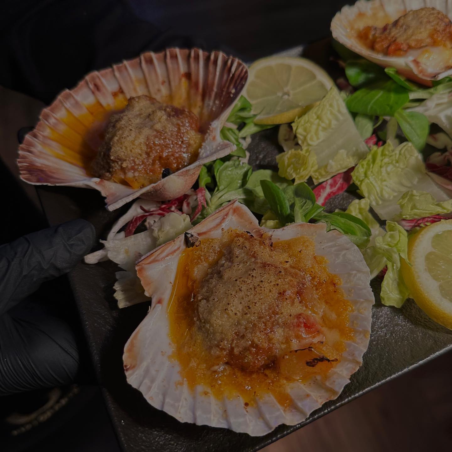A baked scallop dish at GIA Restaurant, a halal restaurant in Amsterdam, Netherlands.
