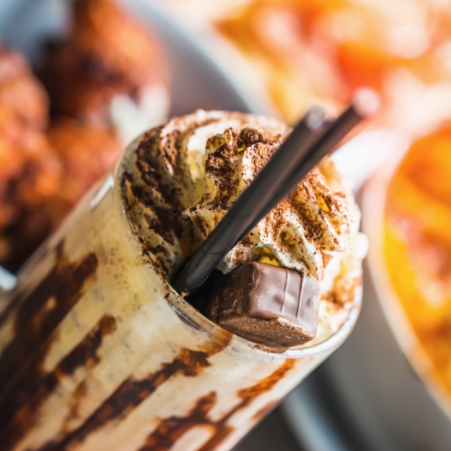 A chocolate milkshake topped with whipped cream and chocolate shavings at Le Passage, a halal restaurant in Molenbeek-Saint-Jean, Belgium.