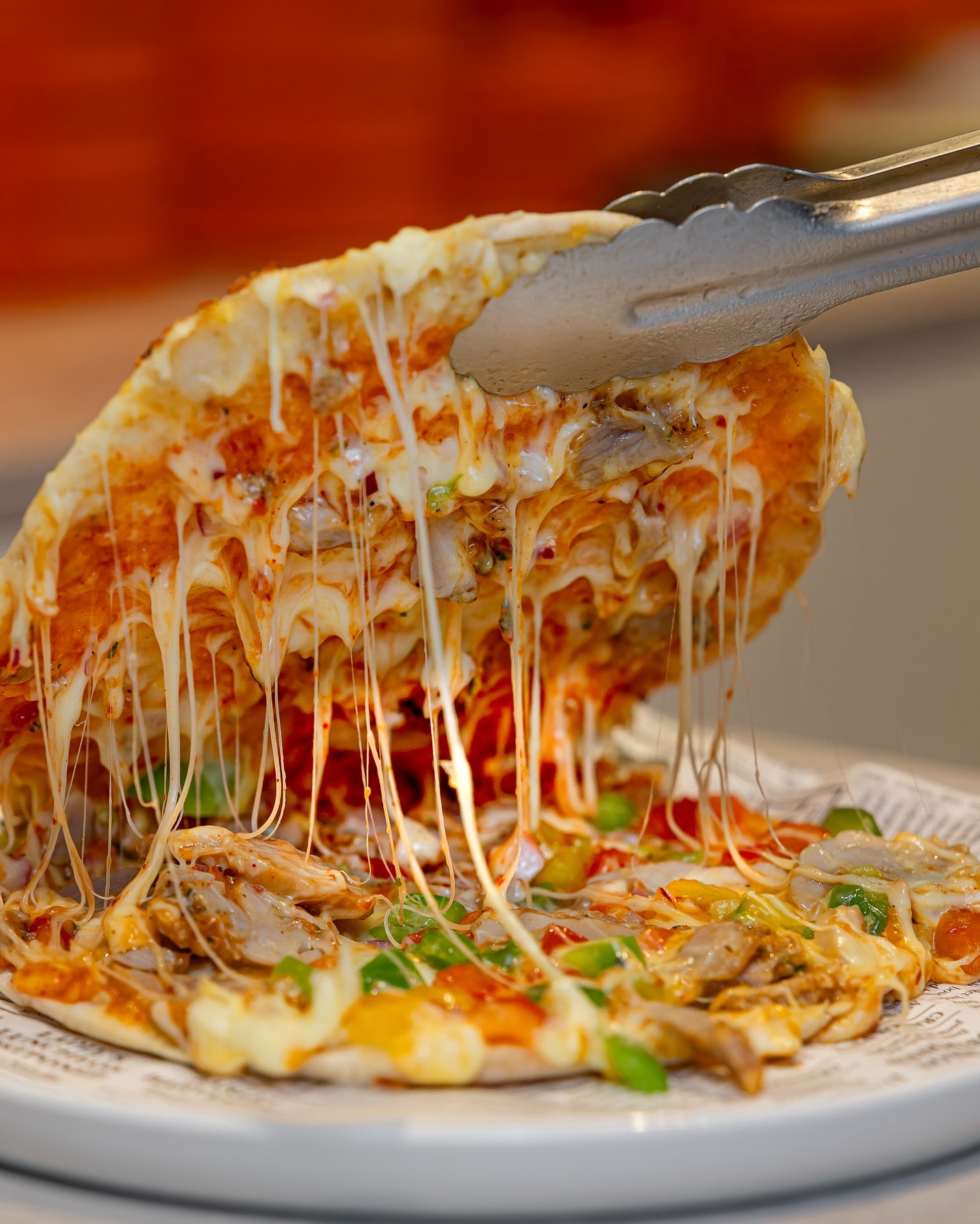A cheesy chicken pizza at Toastup, a halal restaurant in Rotterdam, Netherlands.