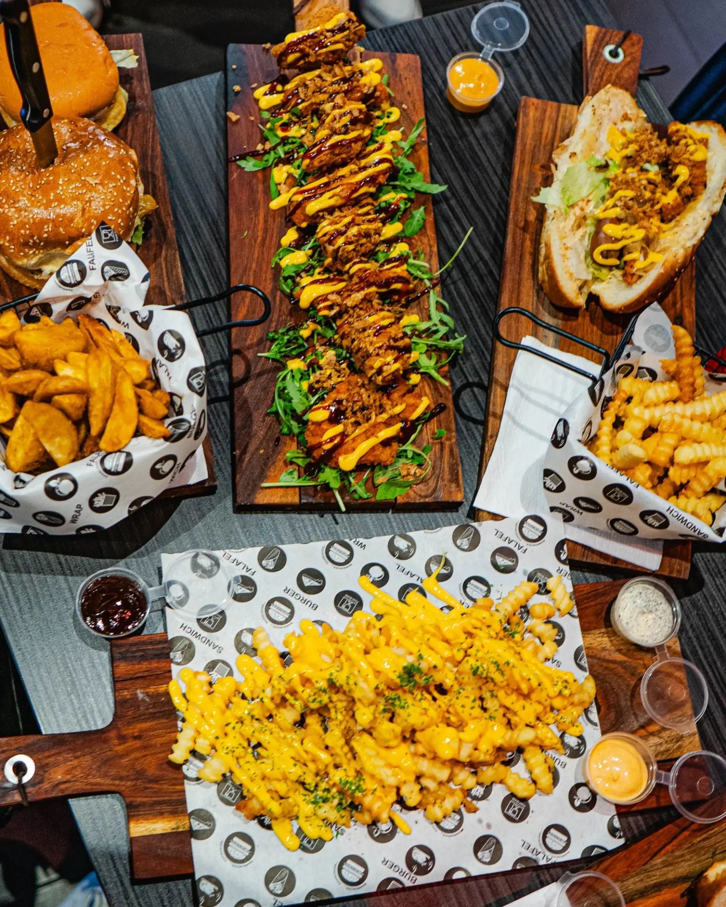 A variety of dishes including burgers, loaded fries, and chicken at Food Korner, a halal restaurant in Anderlecht, Belgium.