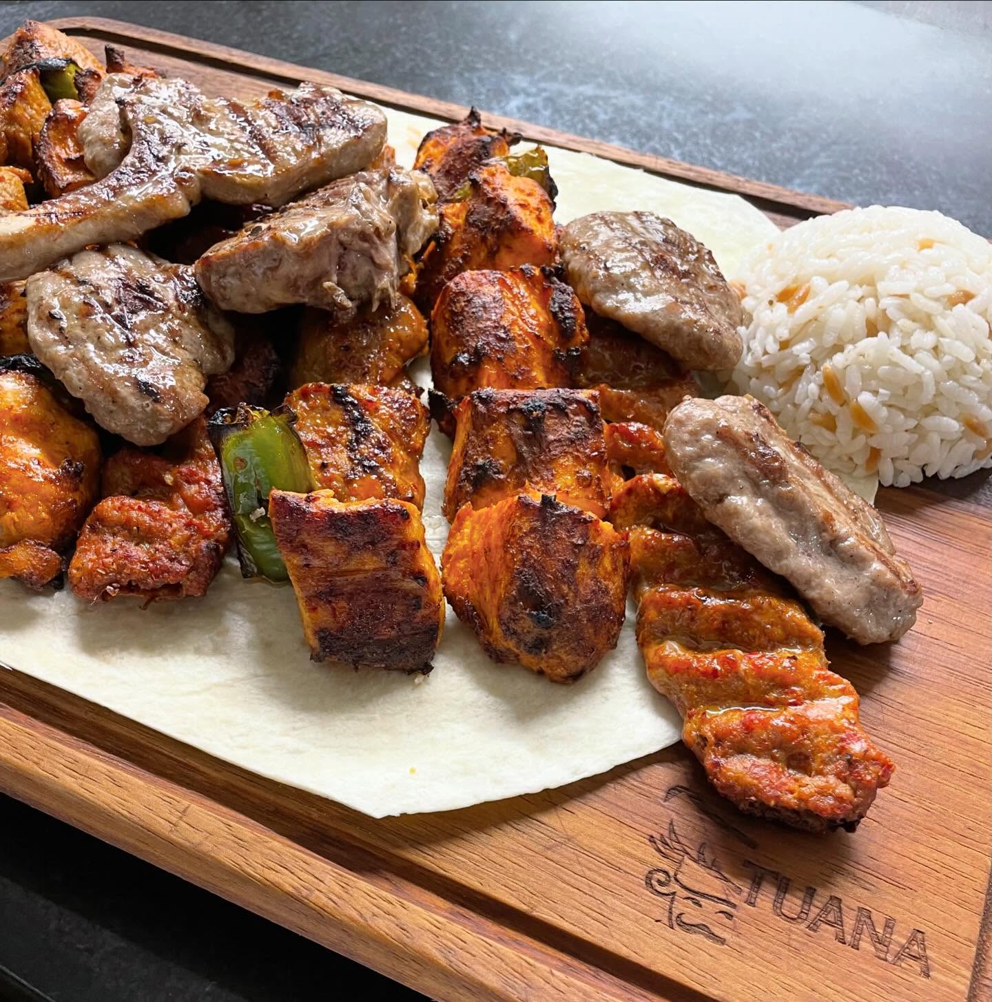 A platter of grilled meats and rice at Tuana, a halal restaurant in Sint-Niklaas, Belgium.