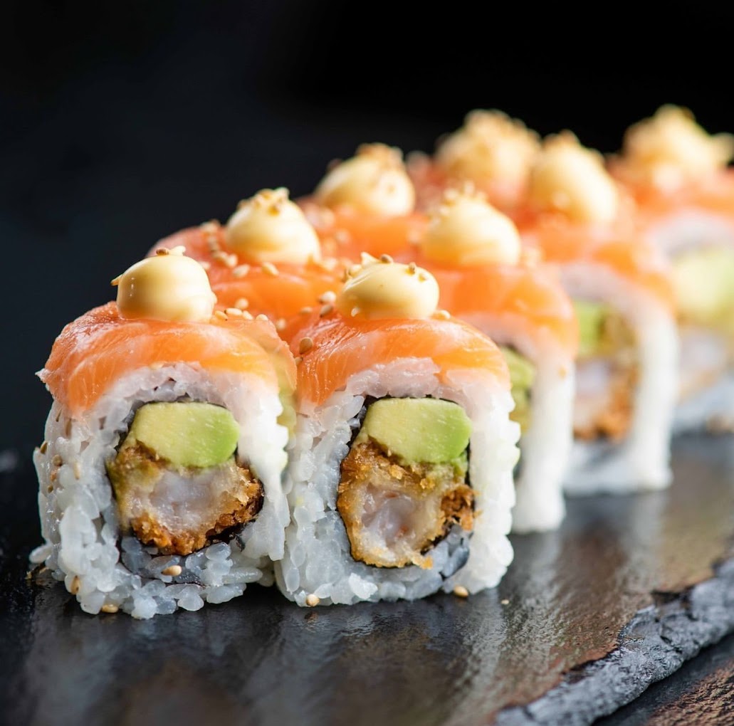 A sushi roll with salmon, avocado, and crispy shrimp at Wokbox, a halal restaurant in Antwerpen, Belgium.