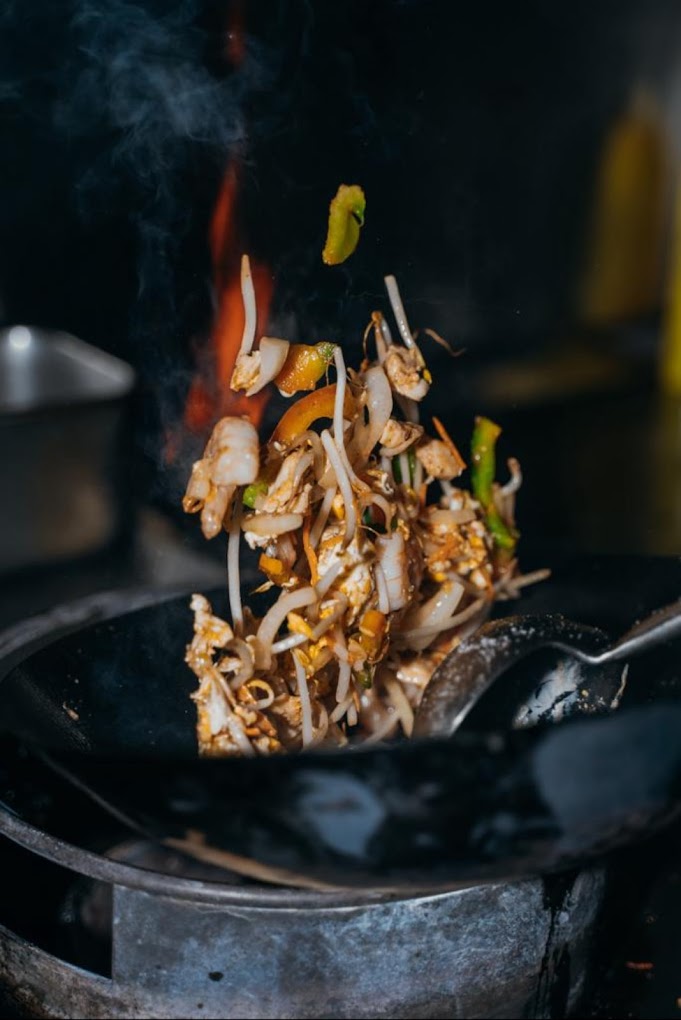 A stir-fried dish with chicken, vegetables, and bean sprouts at Wokbox, a halal restaurant in Antwerpen, Belgium.