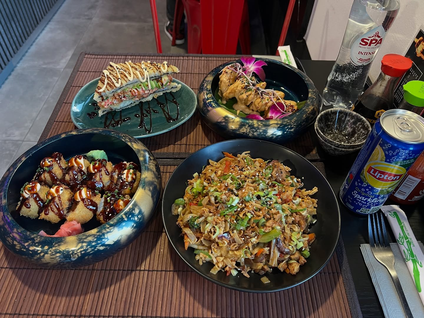 A variety of sushi and fried rice at Wokcity 'N Roll, a halal restaurant in Mortsel, Belgium.
