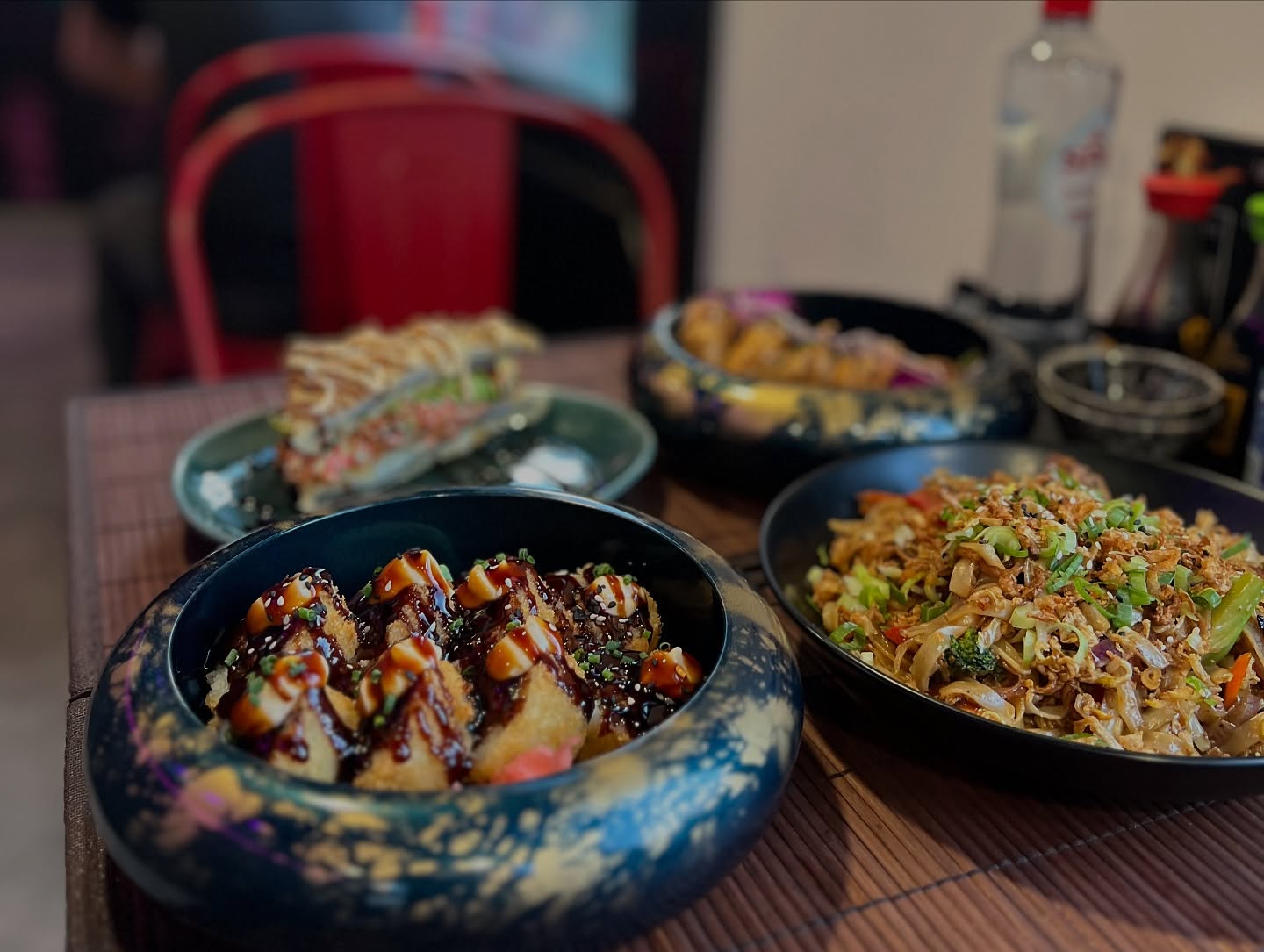 A plate of sushi rolls and noodles at Wokcity 'N Roll, a halal restaurant in Mortsel, Belgium.