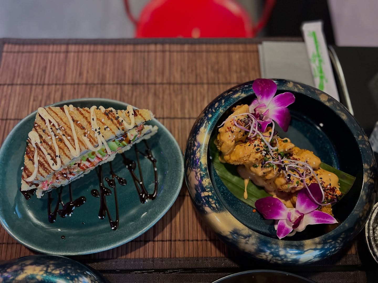 A sushi dish with a crispy exterior and drizzled sauce at Wokcity 'N Roll, a halal restaurant in Mortsel, Belgium.