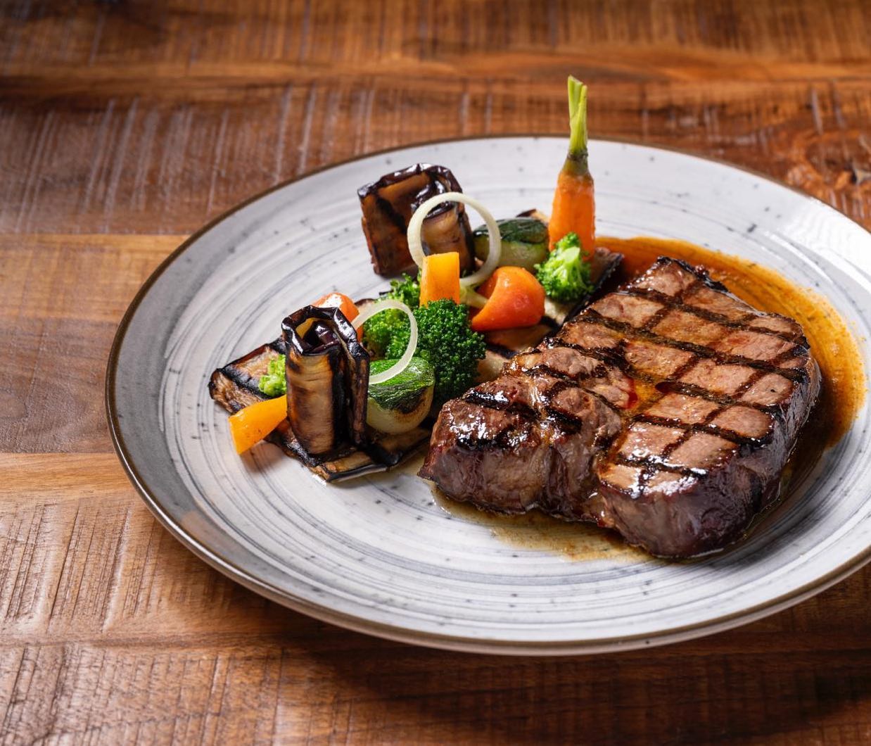 A grilled steak with vegetables at Buffalo, a halal restaurant in Beringen, Belgium.