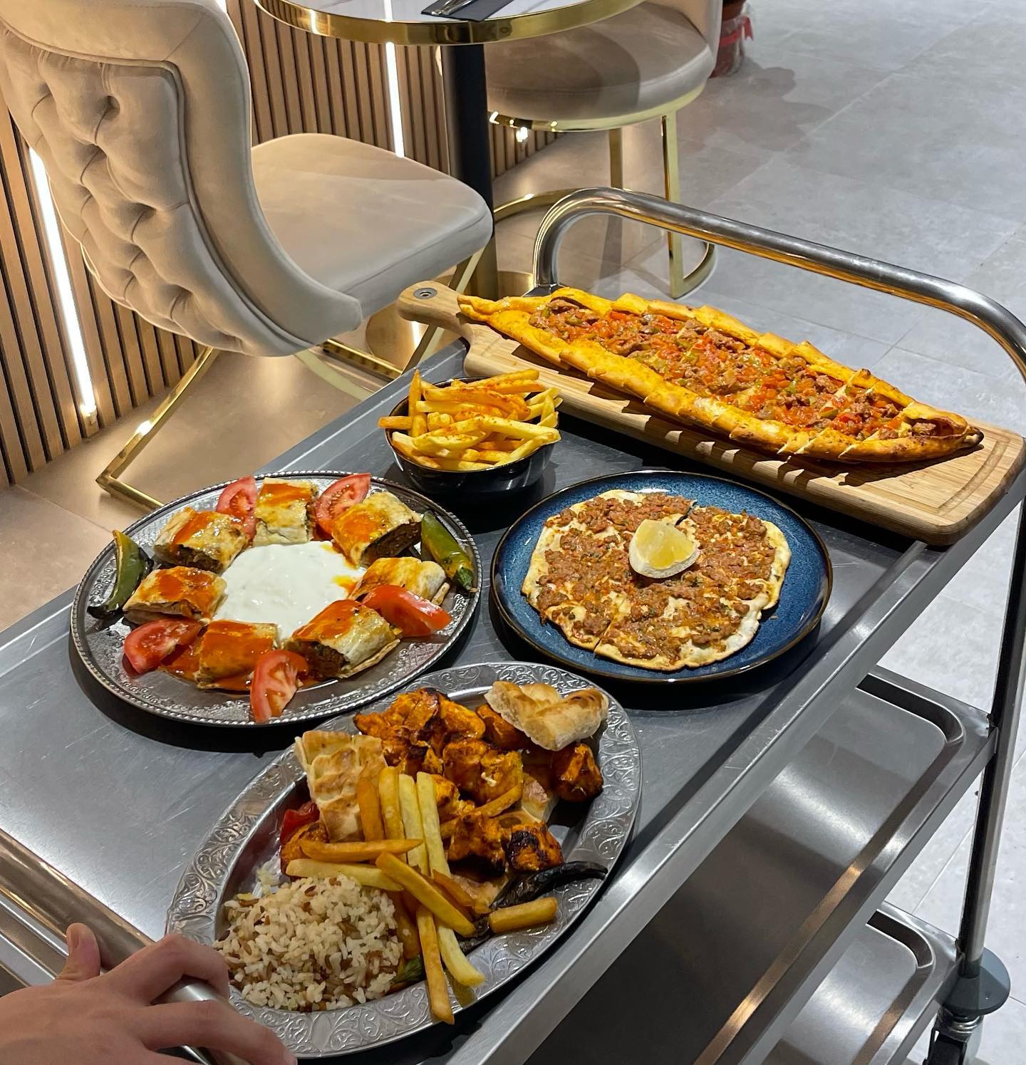 A variety of halal dishes including kebabs, rice, and bread at Liva Restaurant & Café, a halal restaurant in Antwerpen, Belgium.