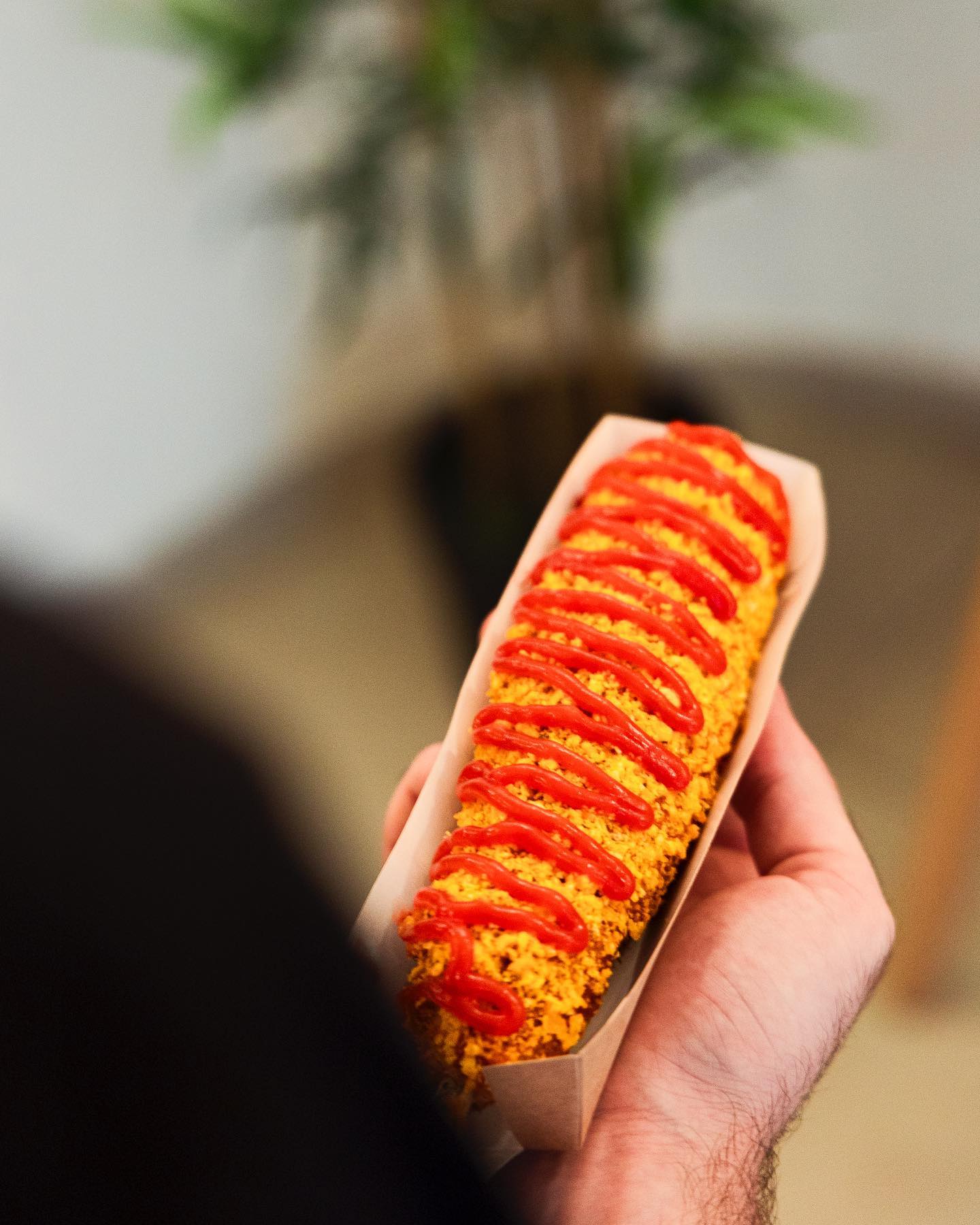 A corndog topped with ketchup at Sekaï Corndogs, a halal restaurant in Bruxelles, Belgium.