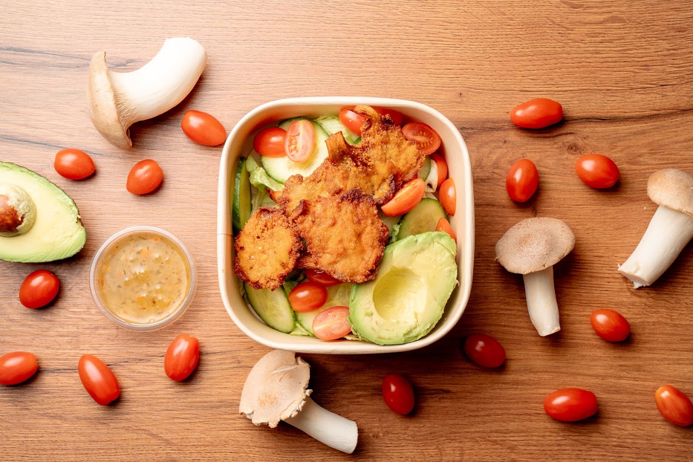 A bowl of salad with fried chicken, avocado, cherry tomatoes, and cucumber at Philly Sandwish Bar, a halal restaurant in Antwerpen, Belgium.